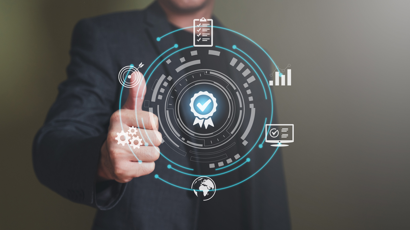 Businessman show thumbs up with icon that show top service quality standard in business or industrial ISO certification. Quality assurance formal concept in organization.