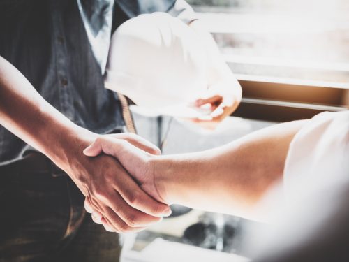 Business Cooperation, Construction, Design agreement concept. Handshake between designer engineers